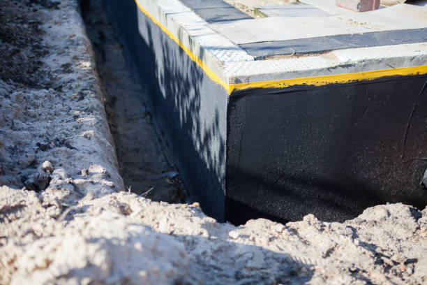 Professional Basement Waterproofing technician working in Hancock, MD